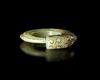 A LIGHT GREEN JADE OUROBOROS DRAGON PENDANT, CHINA, WESTERN ZHOU DYNASTY