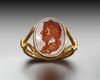 A RENAISSANCE CARNELIAN INTAGLIO PORTRAIT OF THE EMPEROR HADRIAN IN A MODERN GOLD RING, CIRCA 17TH CENTURY A.D.