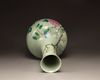 A Chinese celadon-ground famille rose bottle vase