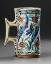 AN OTTOMAN IZNIK POTTERY TANKARD, TURKEY 17TH CENTURY