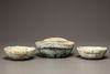 Three green glazed pottery ear cups