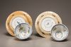 Two pairs of café-au-lait-ground famille verte cups and saucers