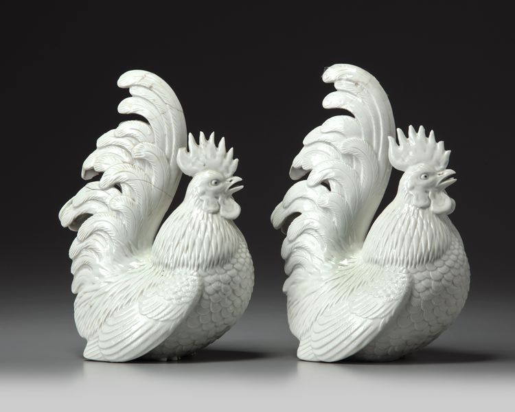 A PAIR OF JAPANESE HIRADO WHITE-GLAZED COCKERELS, MEIJI PERIOD (1868-1912)