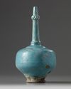 An Islamic turquoise glazed bottle vase
