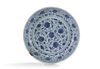 A Chinese Ming-style blue and white 'flower scroll' charger