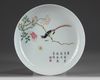 A CHINESE FAMILLE ROSE RUBY-BACK 'BIRD AND FLOWER' DISH