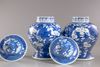 A pair of blue and white Chinese 'cherry blossom' vases and covers