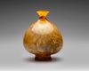 AN AMBER GLASS VESSEL, PERSIA, 10TH–11TH CENTURY
