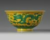 A CHINESE YELLOW-GROUND GREEN-ENAMELLED DRAGON' BOWL, QIANLONG SEAL MARK IN UNDERGLAZE BLUE AND OF THE PERIOD 1736-1795