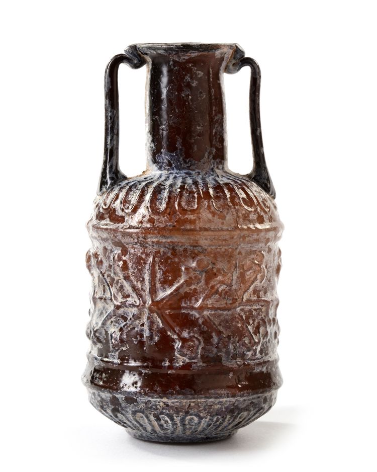 A ROMAN SIDONIAN MOLD-BLOWN FLASK, CIRCA 1ST CENTURY A.D.