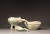 A GREEN-GLAZED RED POTTERY MODEL OF A YI, A LADLE AND BRAZIER, HAN DYNASTY (206 BC - 220 AD)