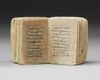 AN ILLUMINATED MINIATURE OTTOMAN QURAN