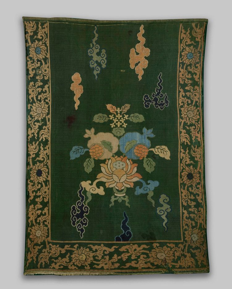 A Chinese green-ground 'lotus and pomegranate' brocade panel