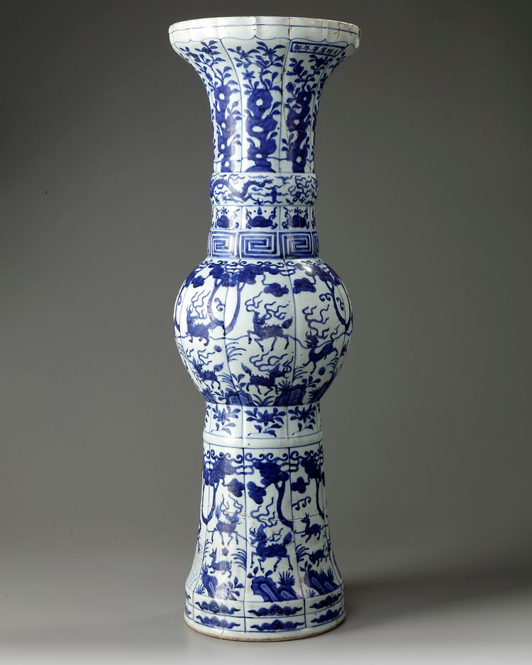 A large Chinese Ming-style blue and white 'mythical beasts' gu vase