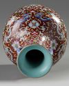 A Chinese red-ground famille rose bottle vase