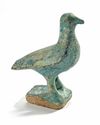 AN ISLAMIC TURQUOISE GLAZED FIGURE OF A BIRD, 13TH CENTURY