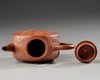 A Chinese yixing 'peony and chilong' flattened teapot and cover