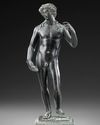 A ROMAN BRONZE STATUETTE OF APOLLO CARNEUS, CIRCA 1ST-2ND CENTURY A.D.