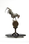A Japanese figure of a rooster on a stand