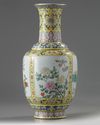 A Chinese yellow ground fmille rose ‘flowers of the four seasons’ vase