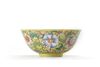 A Chinese yellow-ground famille-rose bowl