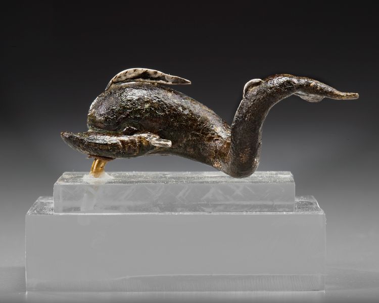 A ROMAN BRONZE DOLPHIN FIGURE, CIRCA 1ST- 2ND CENTURY A.D.