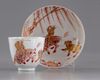 A gilt Chinese cup and saucer