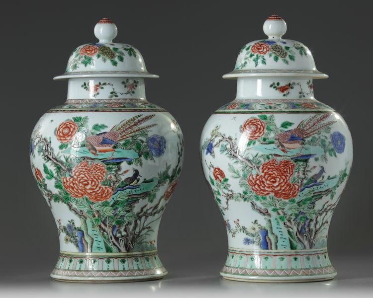 A pair of Chinese famille verte 'pheasants and peony' vases and covers