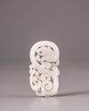 A Chinese white jade 'twin dragon' plaque