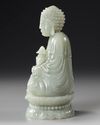 A CHINESE CARVED JADE SEATED BUDDHA, QING DYNASTY (1644–1911)