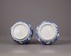 A pair of Chinese moulded blue and white 'Kraak' garlic neck vases