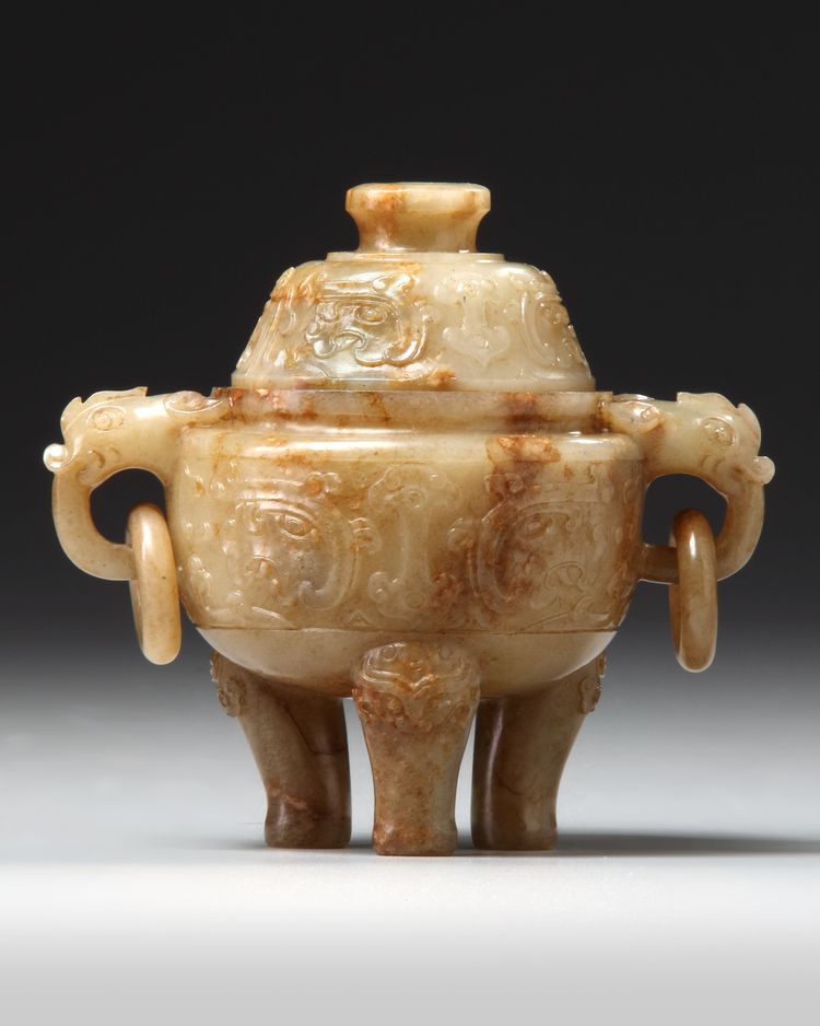 A CHINESE RUSSET JADE TRIPOD CENSER AND COVER 