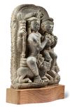 A NORTH-INDIAN SANDSTONE CARVING OF SHIVA AND PARVATI