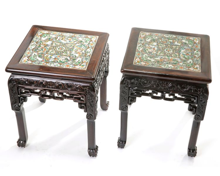 A pair of Chinese hongmu stools inset with a Cantonese famille rose panel