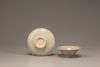 A small Yaozhou celadon conical bowl and a celadon-glazed cup stand