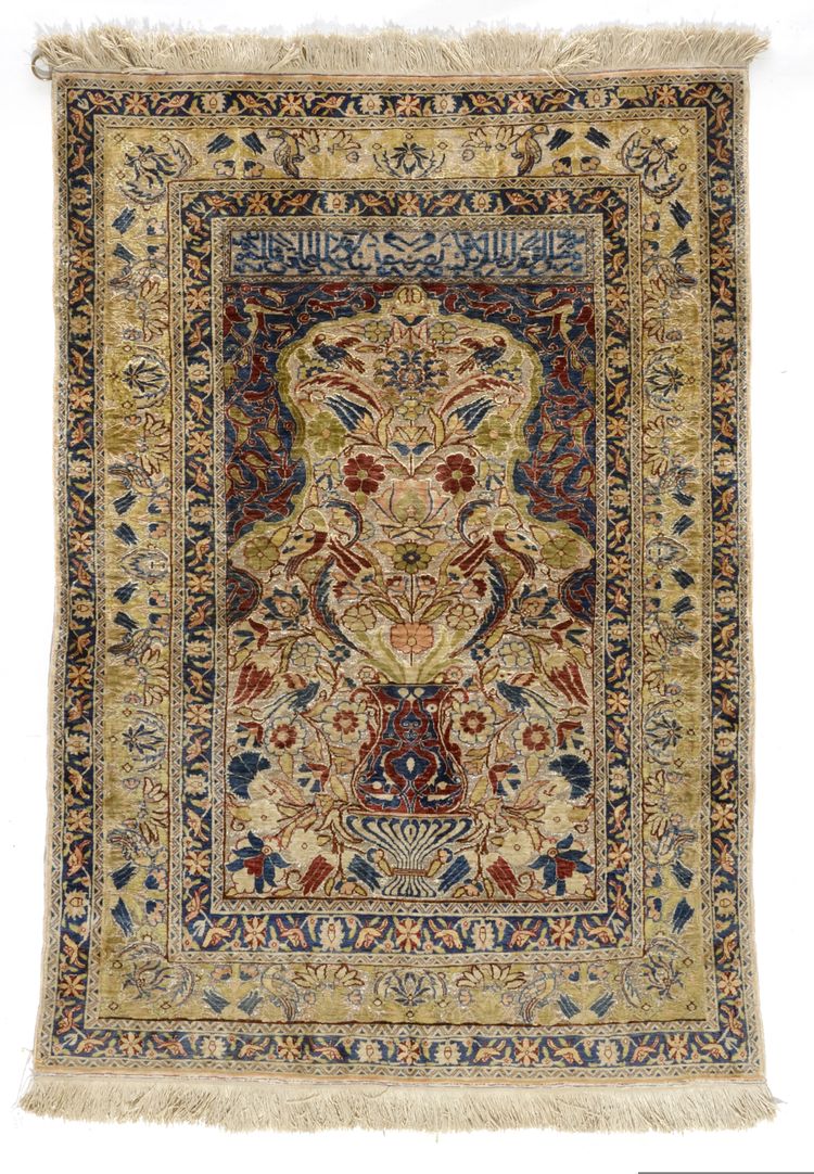 A FINE SILK AND METAL TURKISH HEREKE SILK RUG