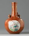 A Chinese coral-ground famille rose 'qilin' vase