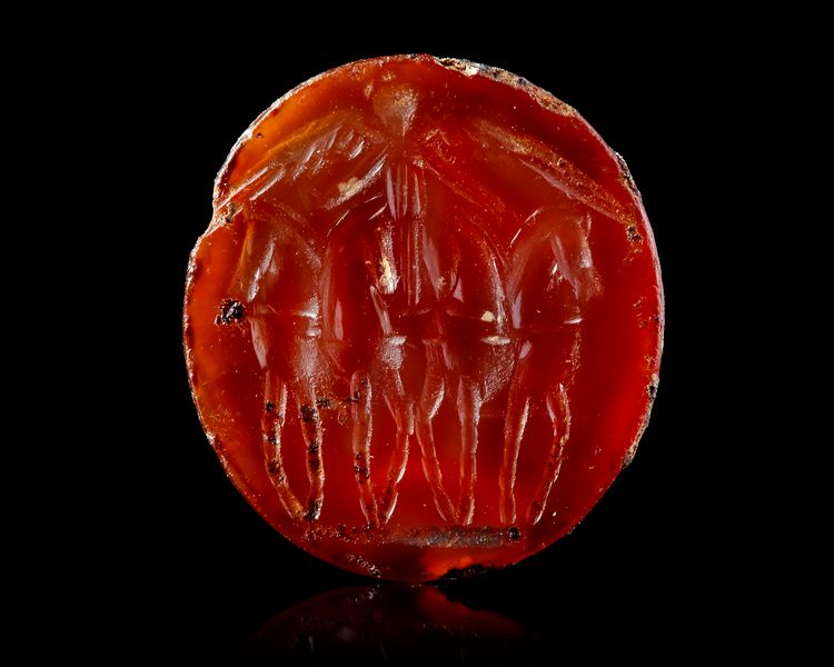 A CARNELIAN INTAGLIO OF A FACING QUADRIGA, 1ST CENTURY AD