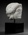 A MARBLE HEAD OF APOLLO, ROMAN 1ST CENTURY AD