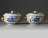A PAIR OF CHINESE CAFE-AU-LAIT-GROUND BLUE AND WHITE POTICHES AND COVER, KANGXI PERIOD (1662-1722)