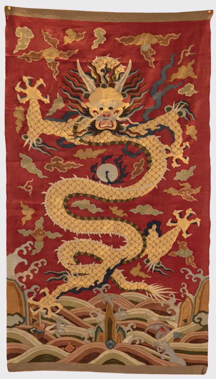 A Chinese red-ground kesi 'dragon' panel