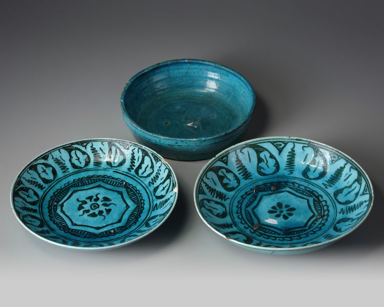 Two Islamic turquoise glazed dishes and a bowl.