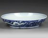 A CHINESE BLUE AND WHITE DRAGON DISH, QING DYNASTY (1644-1911)
