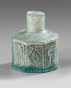 A MOLDED HEXAGONAL GLASS BOTTLE, 7TH–9TH CENTURY