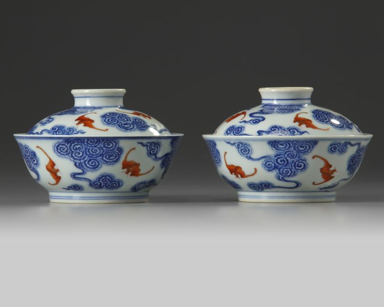 A pair of Chinese iron-red and gilt decorated blue and white bowls and cover
