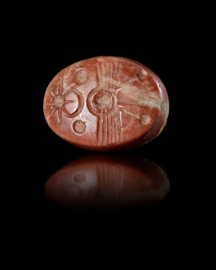 A NEO BABYLONIAN STAMP SEAL IN RED STONE, 6TH-7TH CENTURY BC