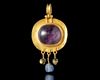 A LATE ROMAN–BYZANTINE GOLD PENDANT WITH AMETHYST MENORAH INTAGLIO, 5TH-7TH CENTURY AD