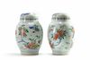 A pair of Chinese wucai 'floral' ovoid vases and covers