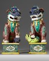 A LARGE PAIR OF CHINESE GLAZED-BISCUIT FAMILLE-VERTE FIGURES OF BUDDHIST LIONS, QING DYNASTY, 19TH CENTURY