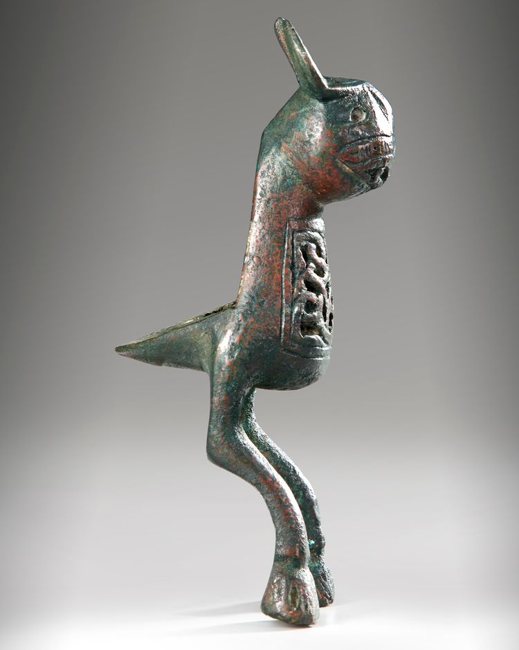 A BRONZE FINIAL IN THE FORM OF HARE, POSSIBLY FATIMID, 11TH-13TH CENTURY